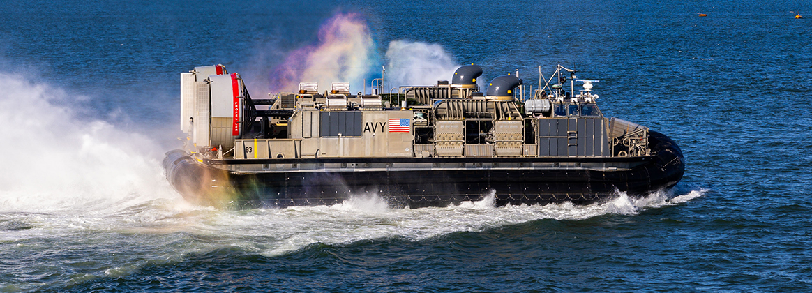 A landing craft air cushion assigned to Assault Craft Unit 4, exits the well deck of the San Antonio-class amphibious transport dock USS San Antonio (LPD 17) while in port. 